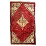 Small Persian red ground rug