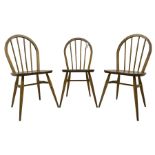 Ercol - 1960s set of three elm and beech 'Windsor' stick and hoop back chairs