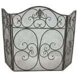 Scrolling wrought metal spark fire screen