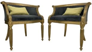 Pair of French design gilt framed tub shaped armchairs