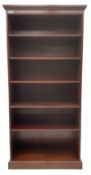 Tall mahogany open bookcase