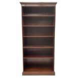 Tall mahogany open bookcase