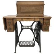 Early 20th century walnut cased 'Singer' treadle sewing machine