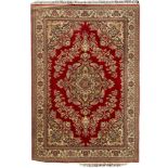 Persian design crimson ground carpet