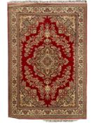 Persian design crimson ground carpet