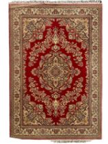 Persian design crimson ground carpet