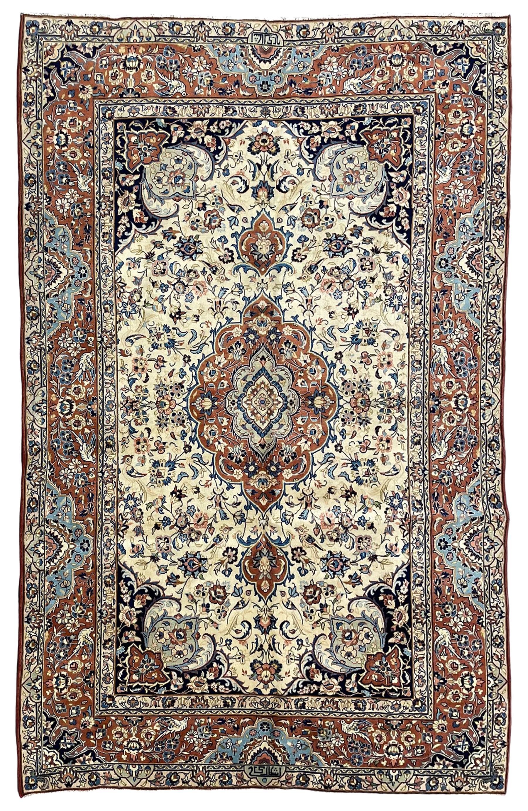 Persian ivory and peach ground rug