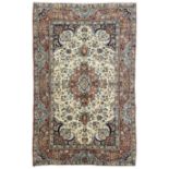 Persian ivory and peach ground rug