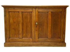 Early 20th century light oak low two door cupboard