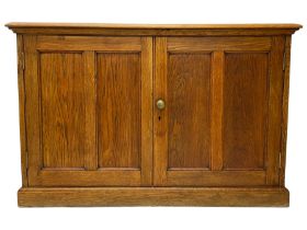 Early 20th century light oak low two door cupboard