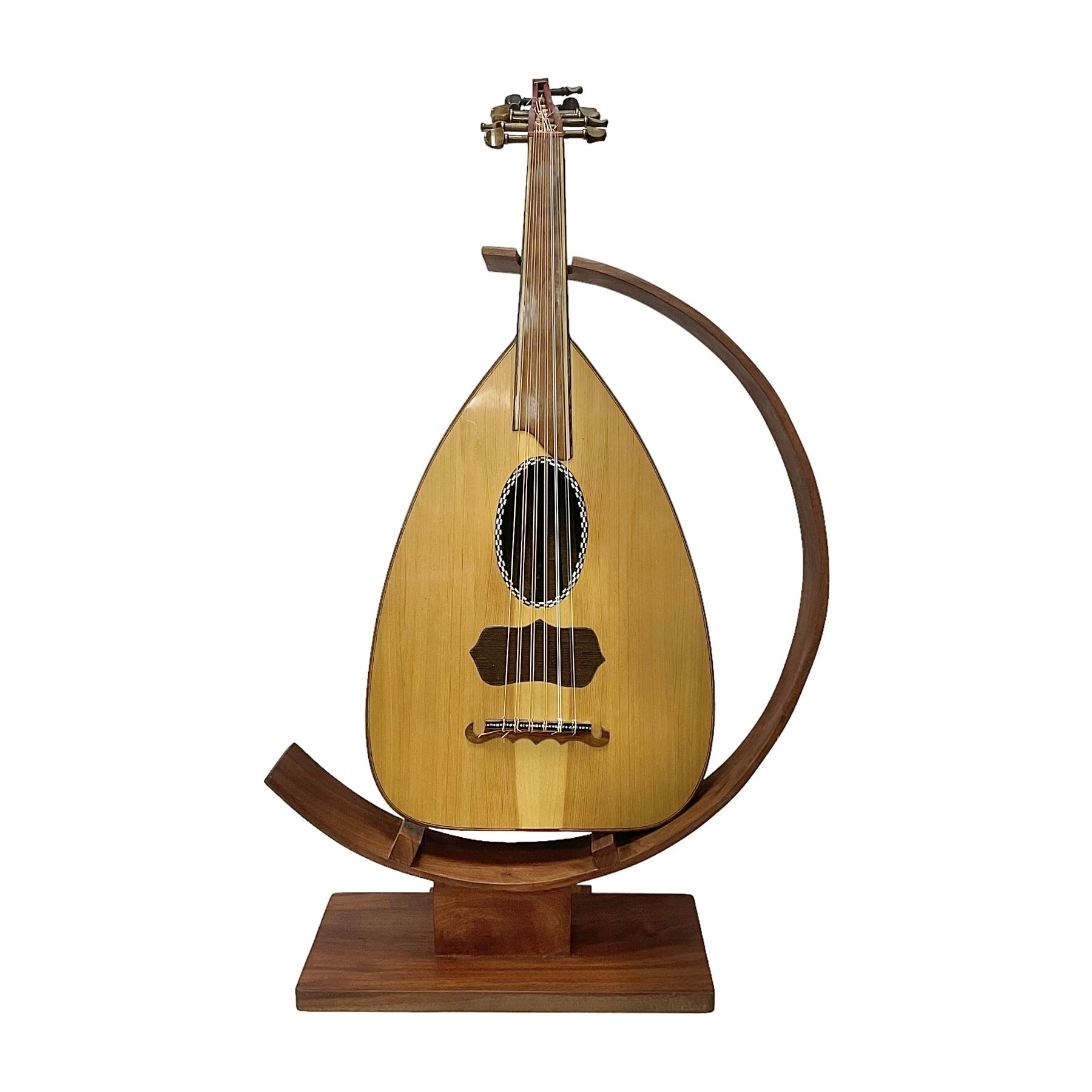 20th century Middle Eastern six string lute with a segmented back and a purpose designed hardwood st