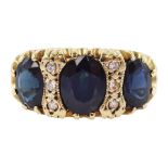 9ct gold three stone oval cut sapphire and six stone diamond ring