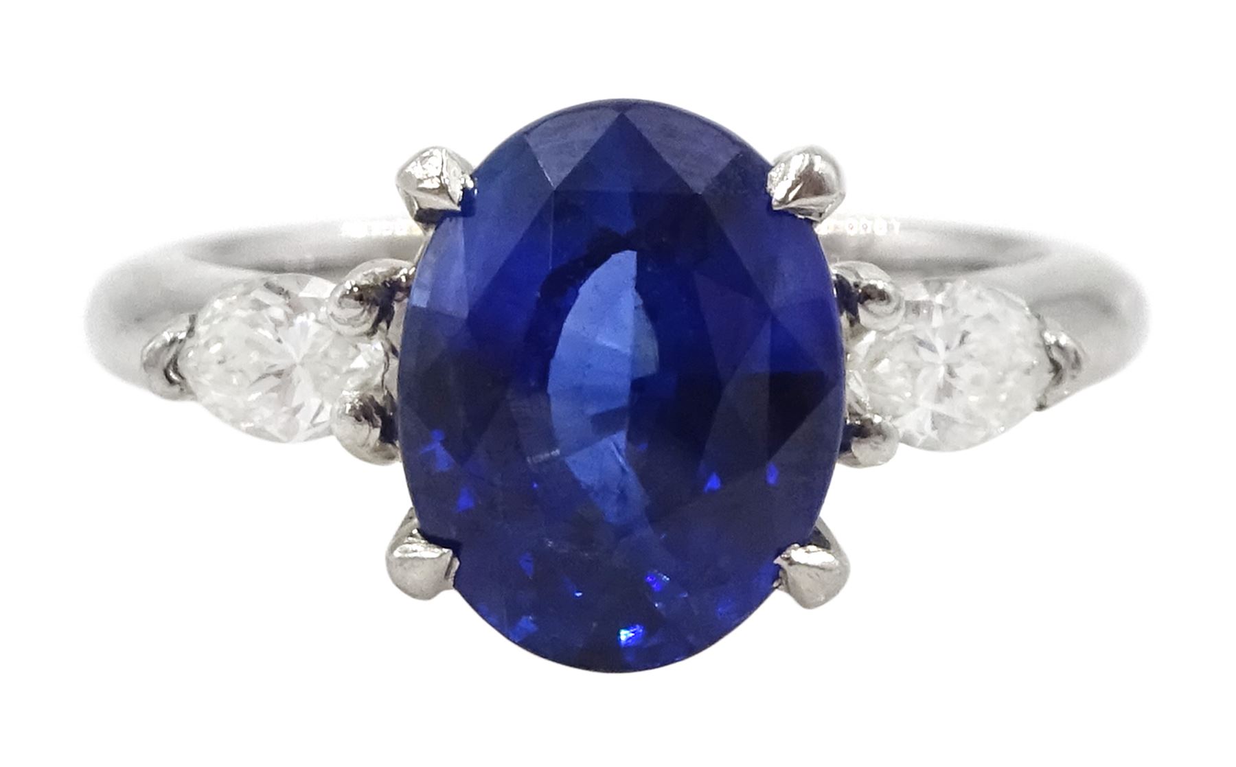 Platinum three stone oval cut sapphire and pear cut diamond ring