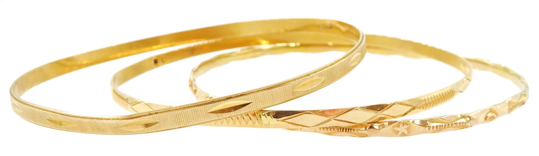 Three Middle Eastern gold bangles