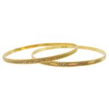 Two Middle Eastern 18ct gold bangles