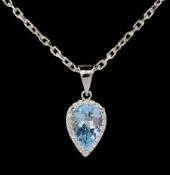 Silver pear cut blue topaz and cubic zirconia pendant necklace