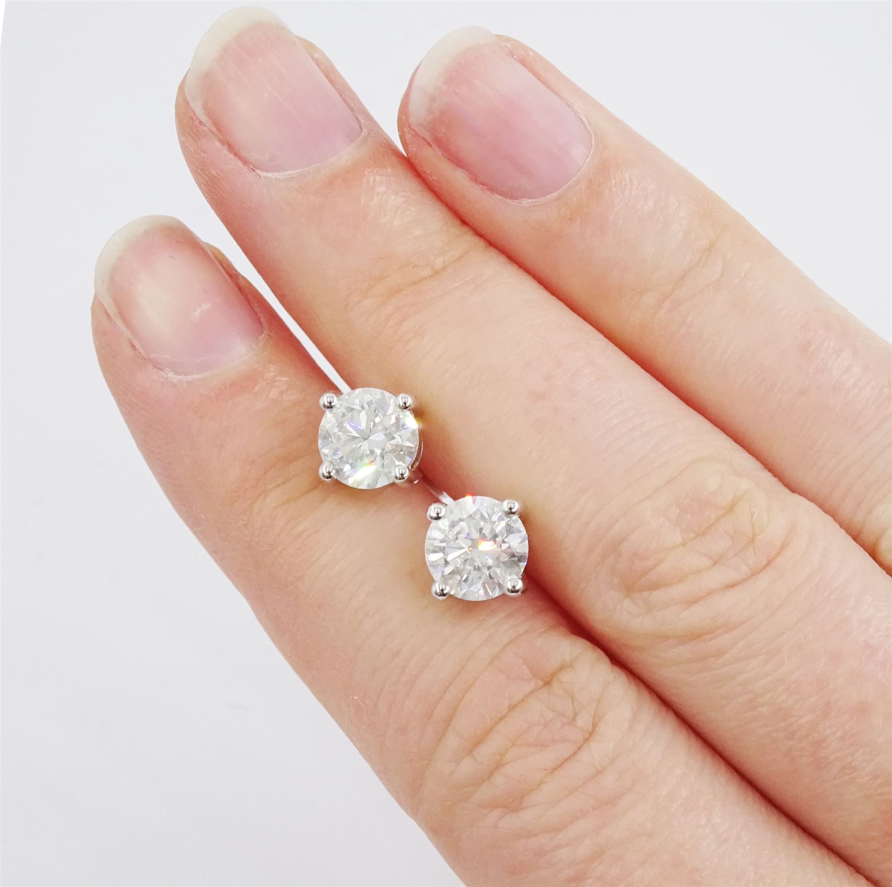 Pair of 18ct white gold round brilliant cut diamond stud earrings - Image 2 of 4