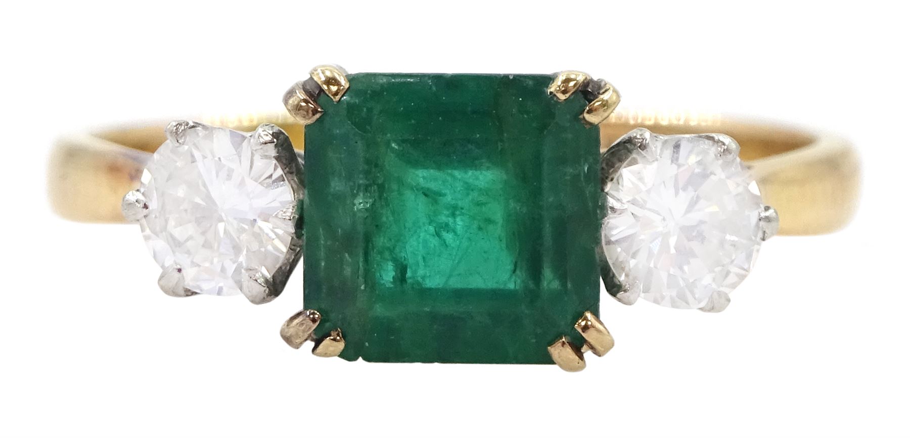 Gold three stone emerald and round brilliant cut diamond ring