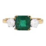 Gold three stone emerald and round brilliant cut diamond ring