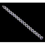 18ct white gold oval cut sapphire and round brilliant cut diamond bracelet