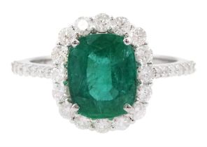 18ct white gold cushion cut emerald and round brilliant cut diamond cluster ring