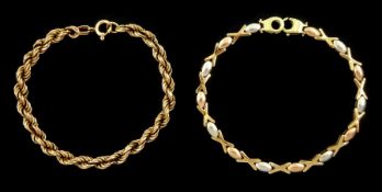 Gold oval and cross link bracelet and a gold rope twist chain bracelet