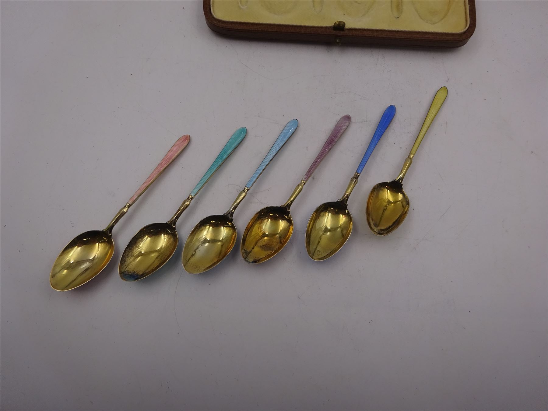 Set of six 1920s silver-gilt and harlequin enamel coffee spoons - Image 5 of 6
