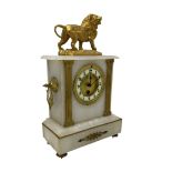 French - mid 19th century 8-day mantle clock in an alabaster case with a flat top surmounted by a gi