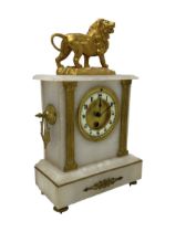 French - mid 19th century 8-day mantle clock in an alabaster case with a flat top surmounted by a gi
