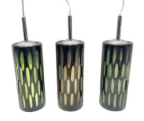 Three contemporary glass pendant lights
