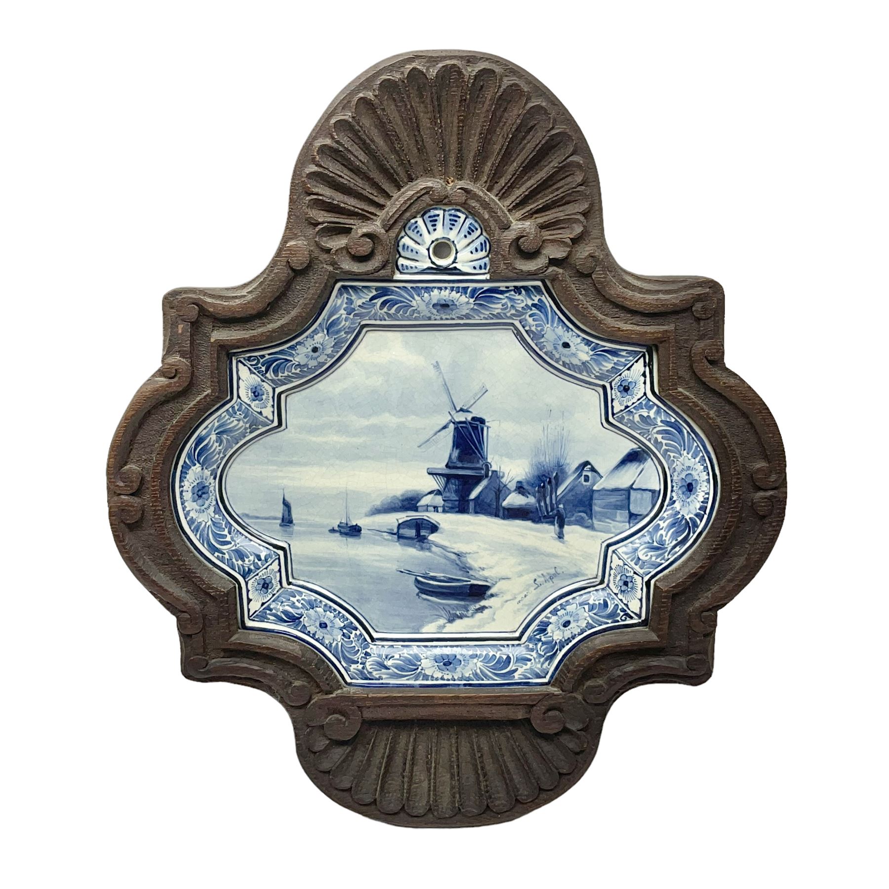 Delft blue and white plaque with decorate with a windmill in a landscape