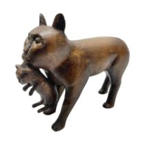 Folk Art wooden carving depicting a cat carrying a kitten