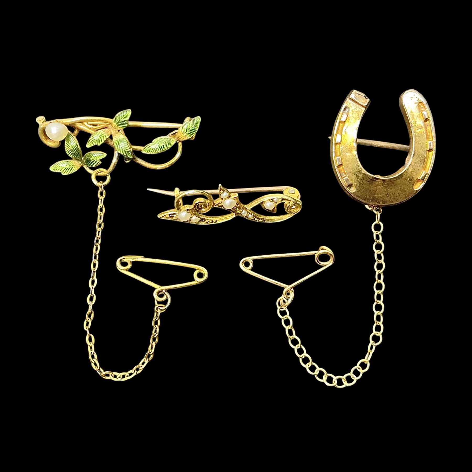 Three gold brooches