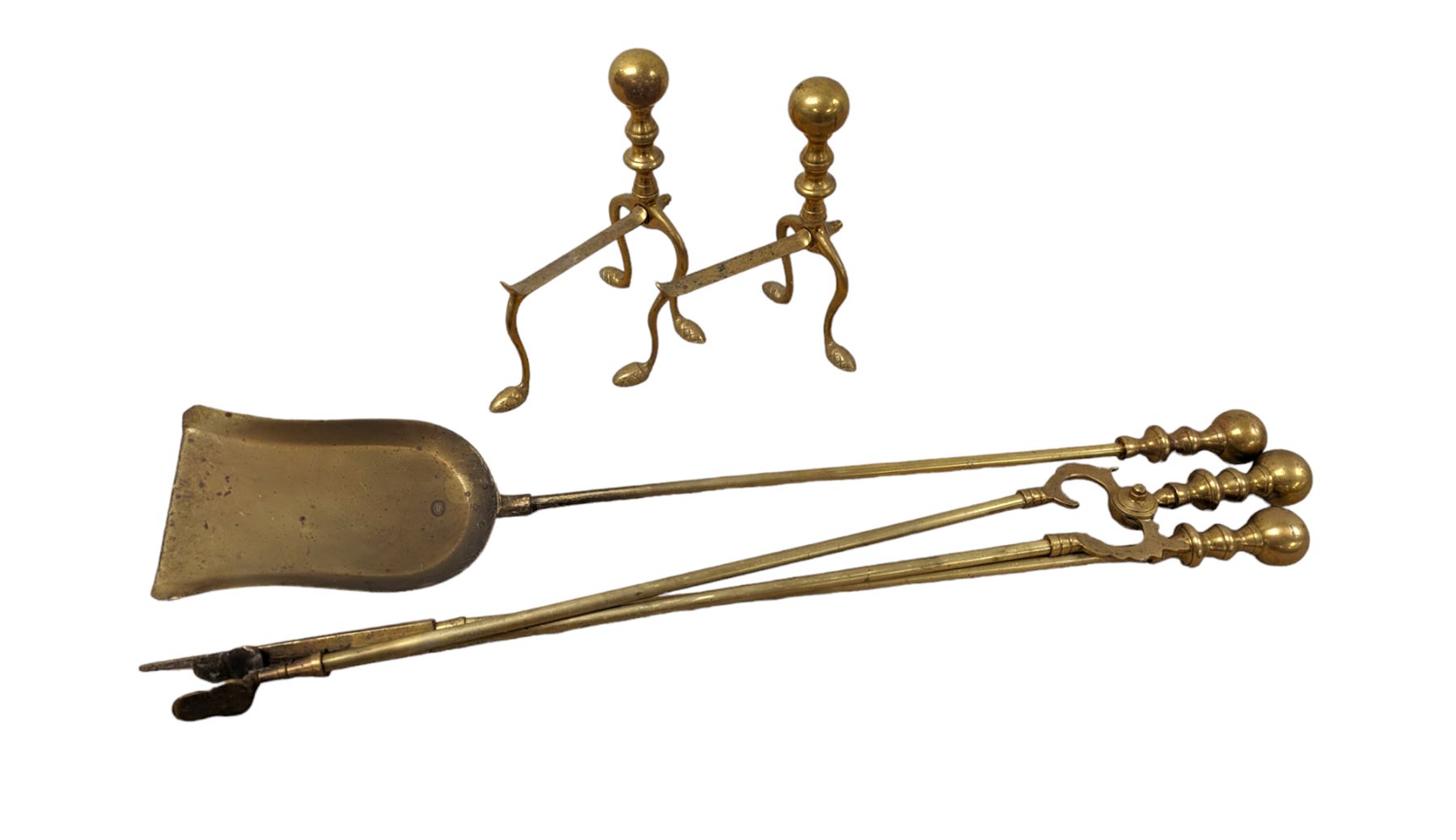 Pair of brass fire dogs and fire accessories