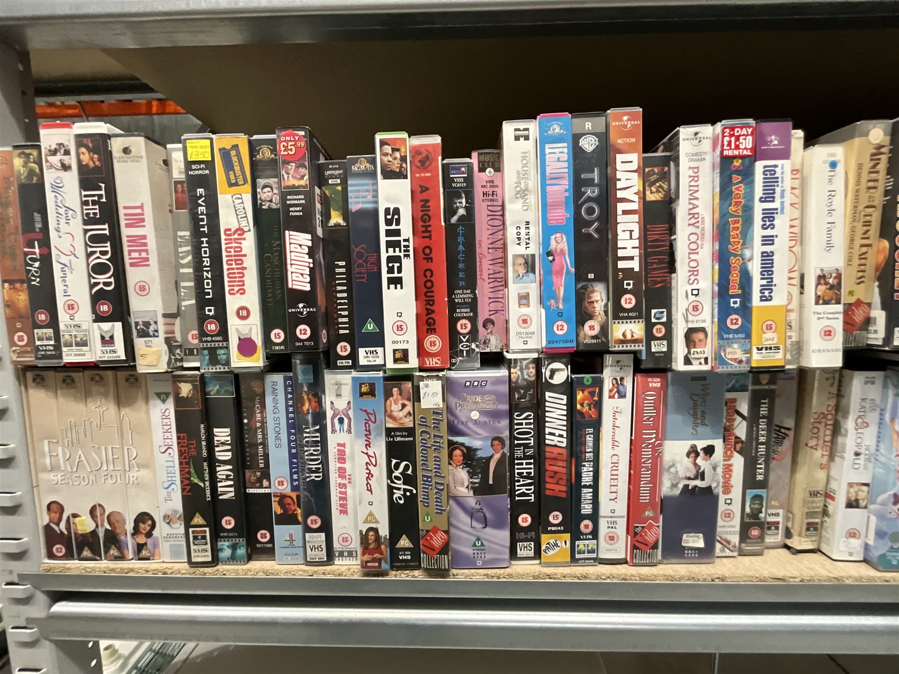 Two bays of vintage VHS videos