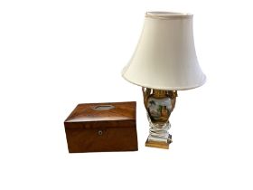 Urn shaped ceramic lamp with swan handles decorated with figural panels