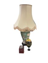 Oriental table lamp upon a wooden stand