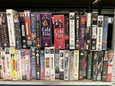 Two bays of vintage VHS videos