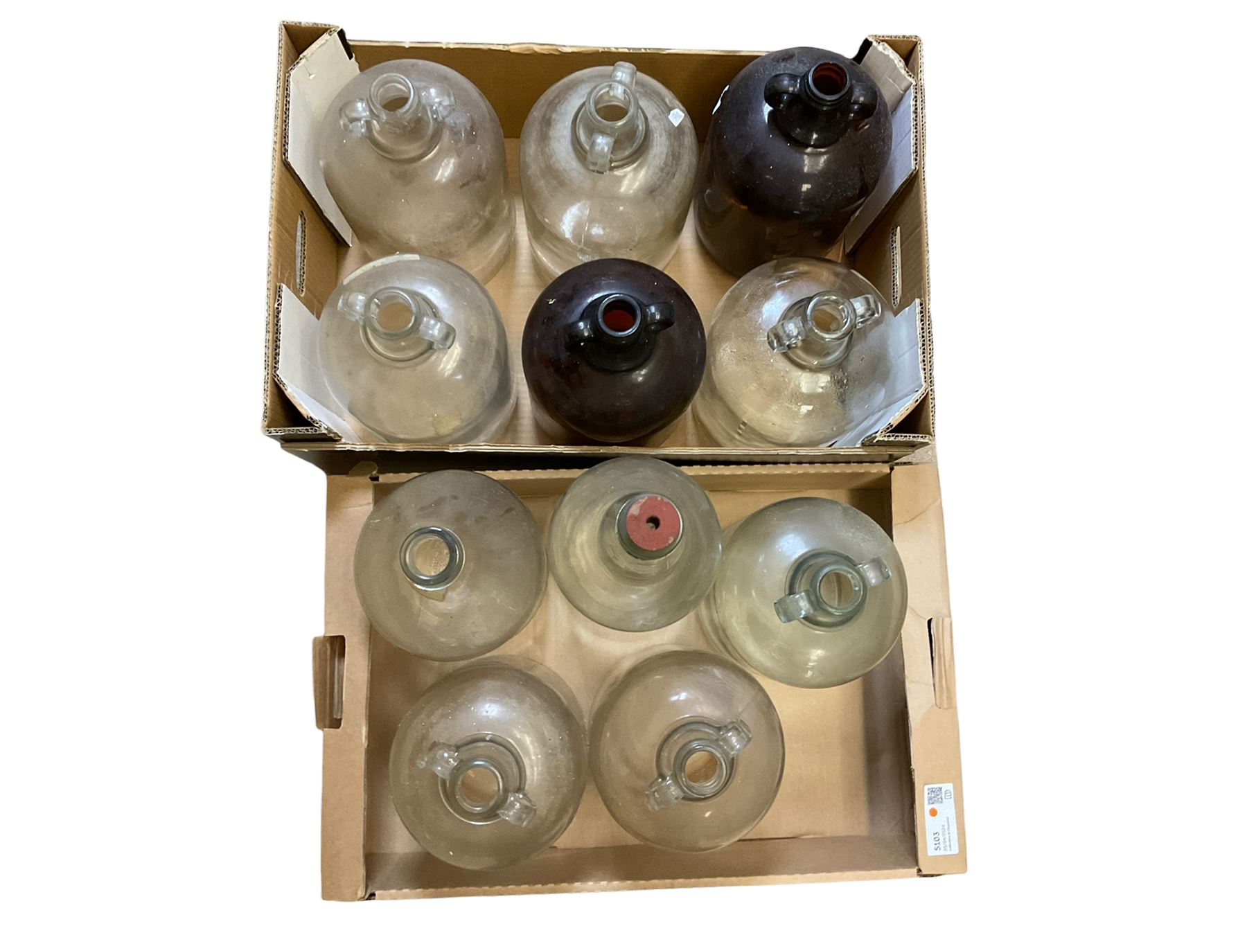 Eleven glass demijohns