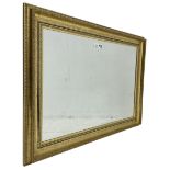 Gilt framed wall mirror with bevelled plate (91cm x 65cm); pair of ladder back carver armchairs (W52