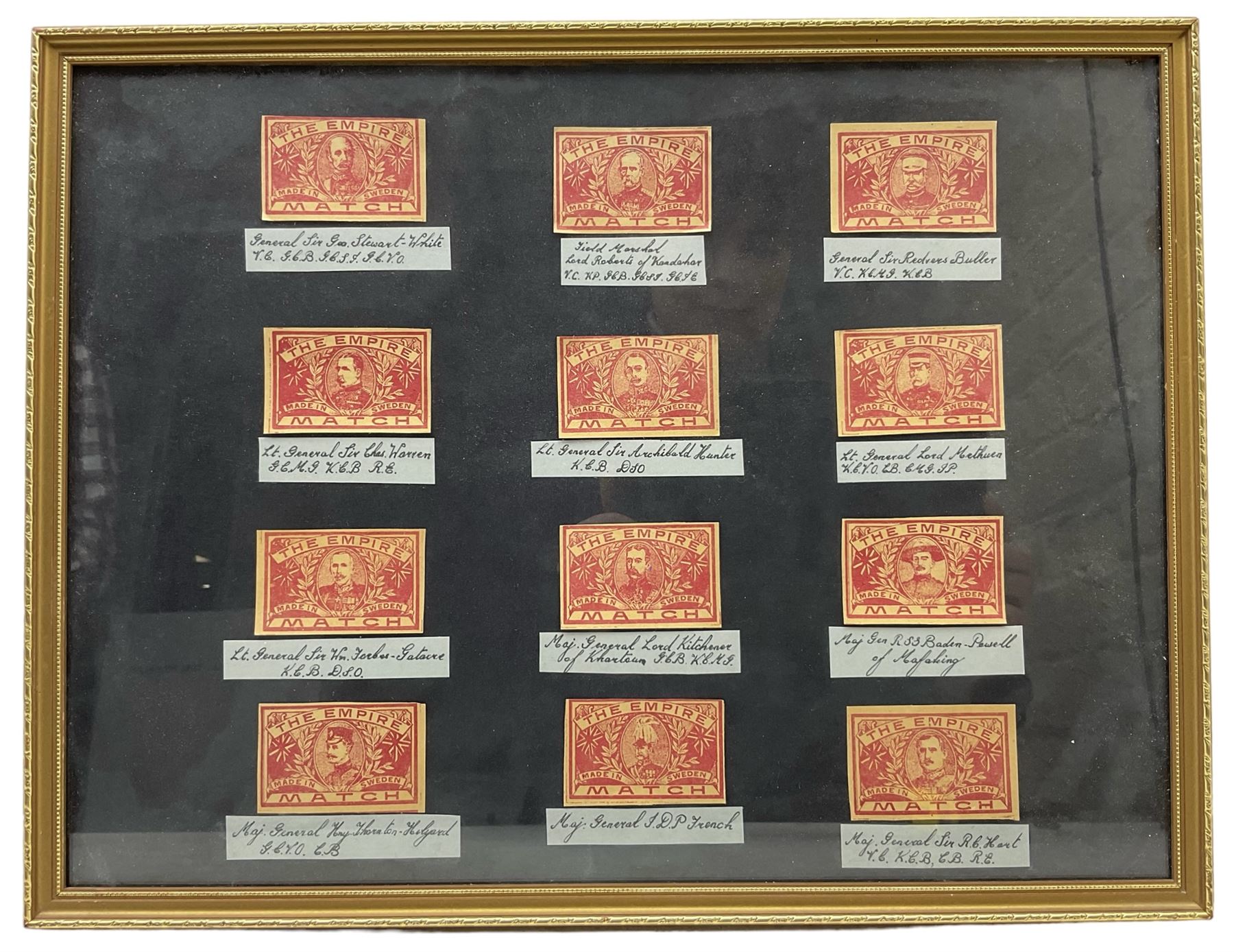 Framed display of twelve The Empire Match matchbox labels