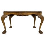 Mid-20th century figured walnut serpentine coffee table