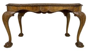 Mid-20th century figured walnut serpentine coffee table
