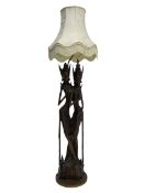 Carved hardwood figural standard lamp