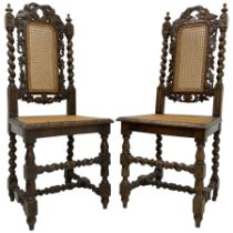 Pair of Victorian Gothic Revival carved oak chairs