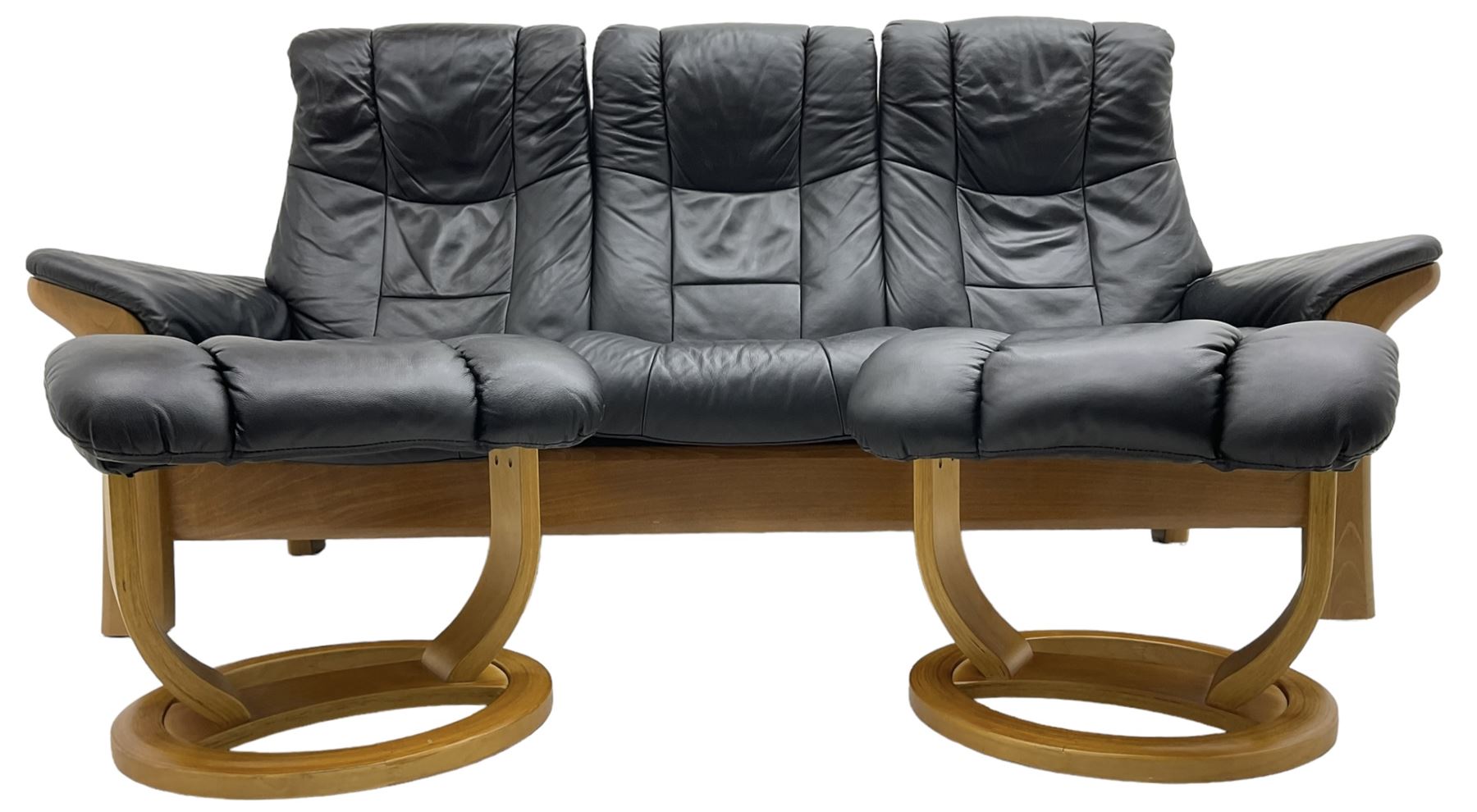 Stressless - 'Buckingham' three-seat settee upholstered in black leather; together with two associat