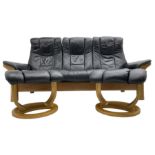 Stressless - 'Buckingham' three-seat settee upholstered in black leather; together with two associat