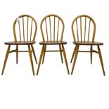 Ercol - set of three 'Windsor' elm and beech stick back chairs