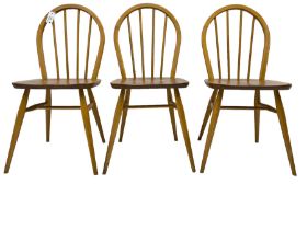 Ercol - set of three 'Windsor' elm and beech stick back chairs