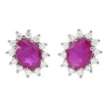Pair of 18ct white gold oval cut ruby and round brilliant cut diamond cluster stud earrings